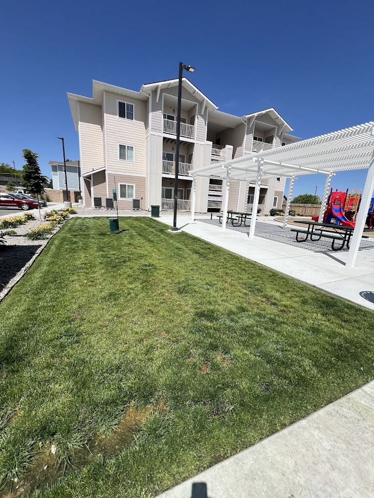 Multi-family apartment complex with freshly mowed common area lawn