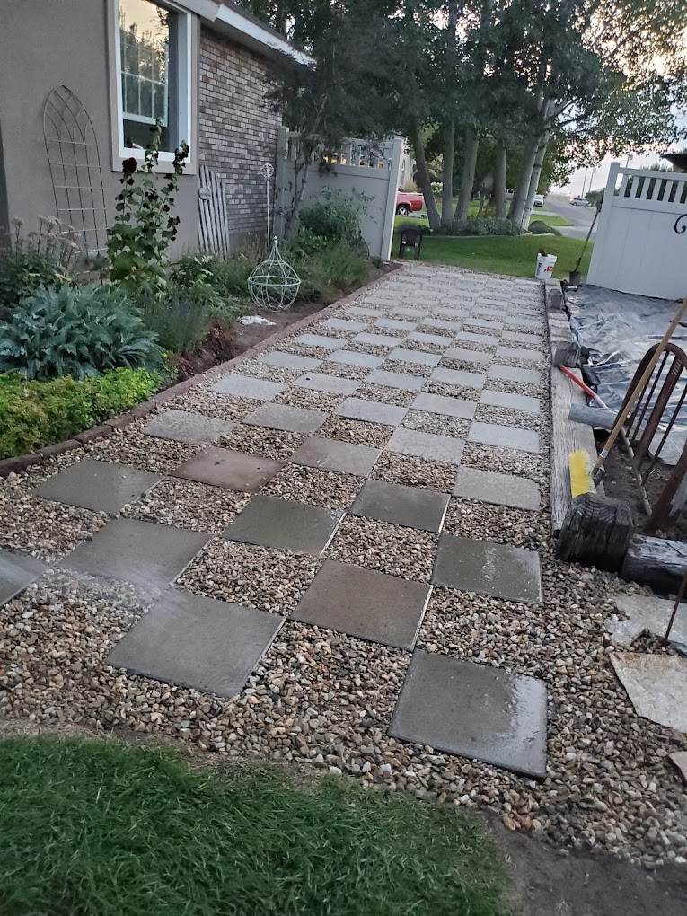 Checkerboard paver and gravel walkway installation