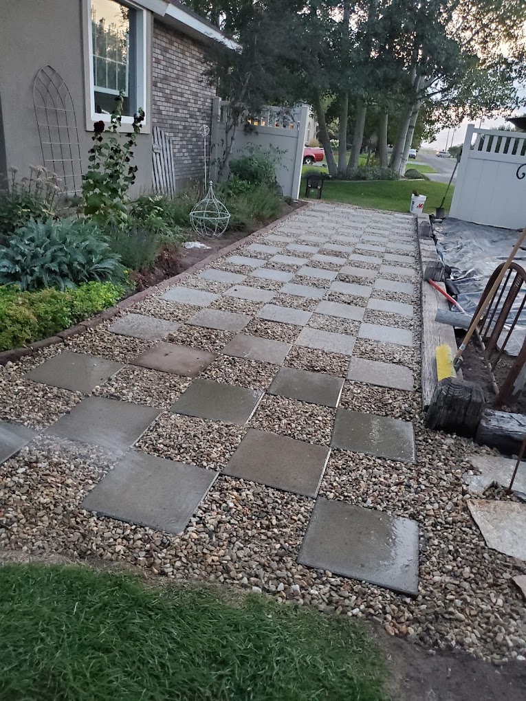 Checkerboard paver and gravel walkway installation